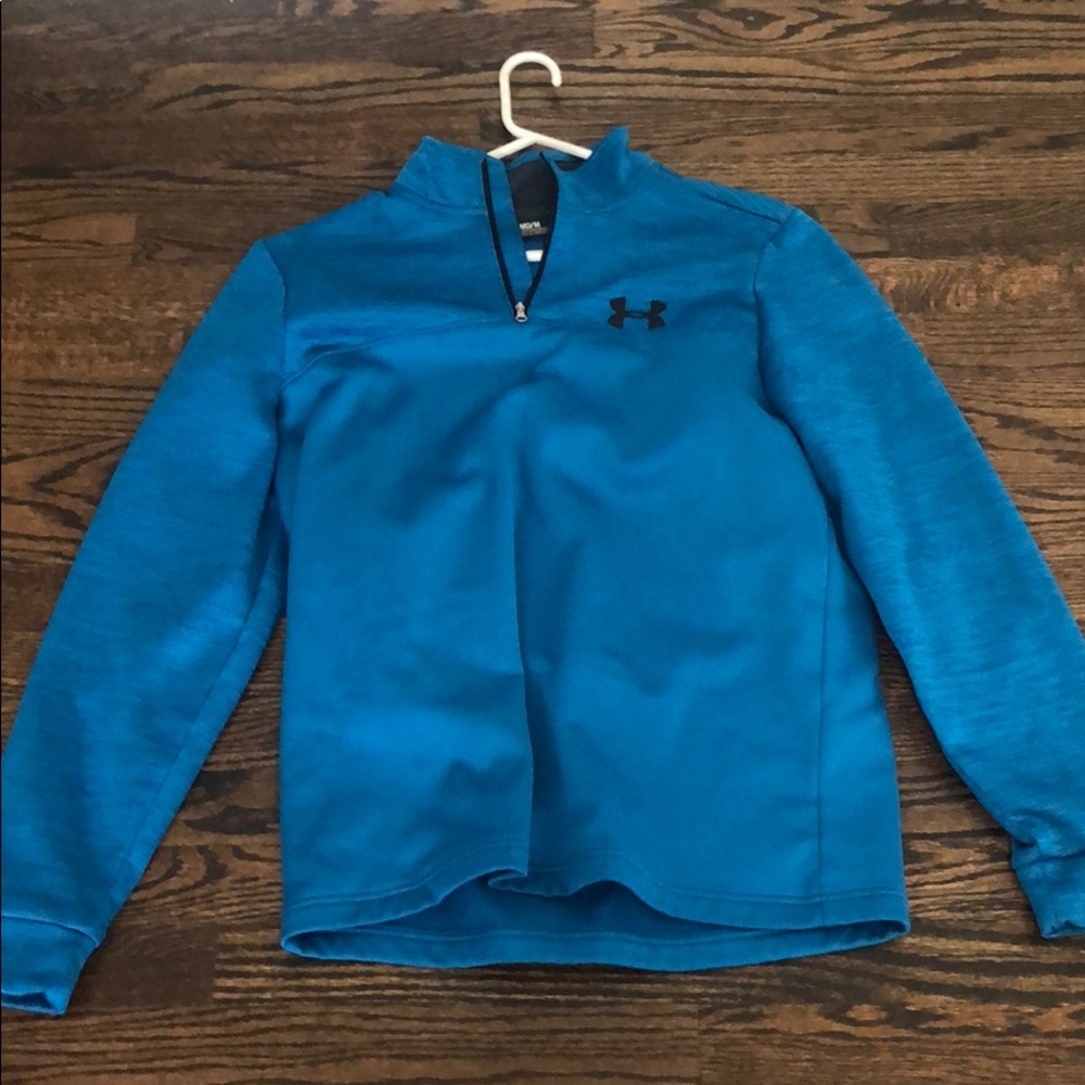 Under armour pull over in teal green. Never worn